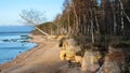 landscape with sandstone cliffs, bare ice, sand and ice formations, Veczemju cliffs, Latvia