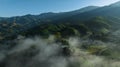 Landscape sapan village in the valley and the sea of mist in the morning with sun rays and mountain shadow layays, in winter