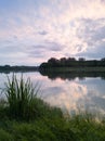 Landscape of Sava river in Poloj near Bosanski Brod, Bosnia and Herzegovina with green grassy and forested shore, calm water with Royalty Free Stock Photo