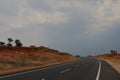 Landscape scene with road towards hill Royalty Free Stock Photo