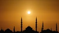 Silhouette islamic mosque with domes and towers with background of sunrising