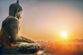 Sitting Budha statue facing sunrising