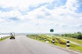 Landscape Scenic road travel on empty highway and Electric Golf Cart near a large reservoir