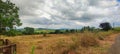 Landscape scenic view of Sahyadri Mountain Ranges from a roadside grass field. Royalty Free Stock Photo