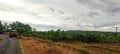 Landscape scenic view of Sahyadri Mountain Ranges from a roadside grass field. Royalty Free Stock Photo