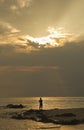 Landscape of sea and cloudy sky which has sun beam shine on sea water and beach in morning Royalty Free Stock Photo