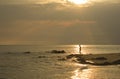 Landscape of sea and cloudy sky which has sun beam shine on sea water and beach in morning Royalty Free Stock Photo