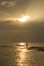 Landscape of sea and cloudy sky which has sun beam shine on sea water and beach in morning Royalty Free Stock Photo