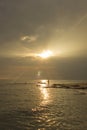 Landscape of sea and cloudy sky which has sun beam shine on sea water and beach in morning Royalty Free Stock Photo