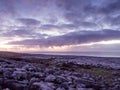 Landscape of sea with dramatic wave and rock in sunset.