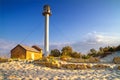 Landscape with sea lighthouse on the coast during sunrise Royalty Free Stock Photo