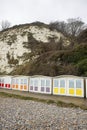 Landscape by the sea. Row of beach huts in Eastbourne East Sussex England UK Royalty Free Stock Photo