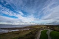 Landscape of a sea shore under clouds