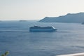 A landscape with sea view. Cruise liner at the sea near the island Santorini, Greece Royalty Free Stock Photo