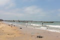 Landscape of seagulls flying over the beach with boats on the sea in the background in the Gambia Royalty Free Stock Photo