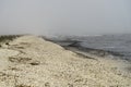 Landscape with seagulls,  sea view with breakwaters,  waves and sea shells,  clouds,  photographed in Gura Portitei,  Romania,  in Royalty Free Stock Photo