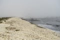 Landscape with seagulls,  sea view with breakwaters,  waves and sea shells,  clouds,  photographed in Gura Portitei,  Romania,  in Royalty Free Stock Photo