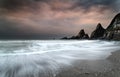 Landscape seascape of jagged and rugged rocks on coastline with