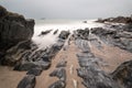 Landscape seascape of jagged and rugged rocks on coastline with