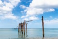 Landscape Seascape Scenery View With Old Bridge Structure Pole Against Blue Sky Background. Perspective Long Beach and Tropical