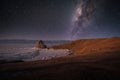 Landscape of Shamanka rock and milky way on sky with natural breaking ice in frozen water on Lake Baikal, Siberia, Russia Royalty Free Stock Photo