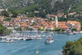 Landscape of ships and boats on a river surrounded by the Old Town of Skradin, Croatia