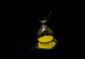 Landscape shot of a broken hourglass with a pitch-black background Royalty Free Stock Photo