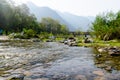 Landscape shot with small river hills and sunlight during morning Royalty Free Stock Photo