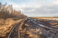 Landscape shot of a peat mining area with rails of a field railway