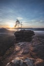 Four castles view, RÃÂ¶tzenfels, a sandstone rock with a cross and a tree. Sunrise, fog, Palatinate Forest, Germany. landscape shot Royalty Free Stock Photo