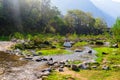 Landscape shot with small river hills and sunlight during morning Royalty Free Stock Photo