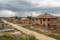 Landscape with buildings in construction and brick houses Royalty Free Stock Photo