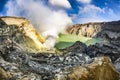 Landscape showing the impressive and colorful Kawah Ijen volcano and lake in a beautiful sunny day, in Java island, Indonesia. Royalty Free Stock Photo