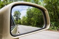 Landscape in the side view mirror of a car Royalty Free Stock Photo