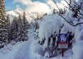 Landscape with a sign warning of the danger of avalanches. Tatry