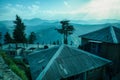 Landscape with silhouettes of mountains rural village houses in the foreground