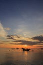 Landscape of sky and sea which has group of small fishing boat at dawn Royalty Free Stock Photo