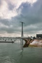 Small boats in the bay of Cadiz on a cloudy day with a huge communications tower in the background Royalty Free Stock Photo