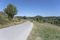 Small road bending in hilly landscape of Lucano Appennines, near Lagonegro, Italy