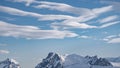 Landscape with snow mountains on cloudy day in Antarctica at aerial view. Frozen fiord Royalty Free Stock Photo