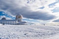 Landscape with snow, panorama of the tower in Serra da Estrela Natural Park with silhouettes of people, Manteigas PORTUGAL Royalty Free Stock Photo