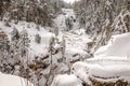 Beautiful landscape of the snowy mountain with its frozen waterfalls Royalty Free Stock Photo