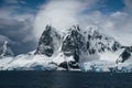 Landscape of snowy mountains and icy shores of the Lemaire Channel in the Antarctic Peninsula, Antarctica. Global Royalty Free Stock Photo