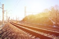 Landscape of a snowy Russian winter railway under bright sunlight The rails and sleepers under the December snow. Russian Railway