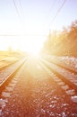 Landscape of a snowy Russian winter railway under bright sunlight The rails and sleepers under the December snow. Russian Railway