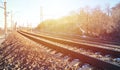 Landscape of a snowy Russian winter railway under bright sunlight The rails and sleepers under the December snow. Russian Railway