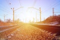 Landscape of a snowy Russian winter railway under bright sunlight The rails and sleepers under the December snow. Russian Railway