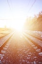 Landscape of a snowy Russian winter railway under bright sunlight The rails and sleepers under the December snow. Russian Railway