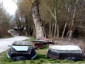 Landscape In the Spring With Rowboats Parked for the Winter