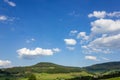 landscape springtime green fields with blue sky and clouds